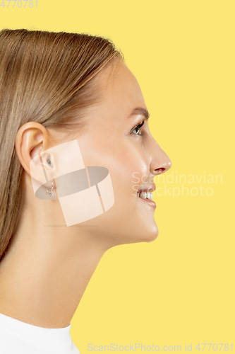Image of Caucasian young woman\'s close up shot on yellow background