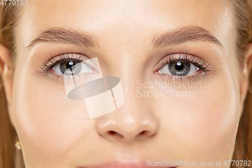 Image of Close up shot of young woman on yellow background