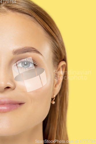 Image of Caucasian young woman\'s close up shot on yellow background