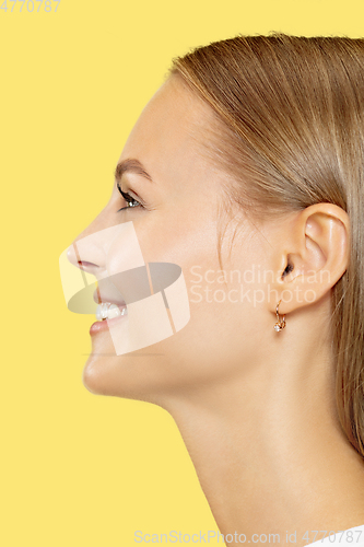 Image of Caucasian young woman\'s close up shot on yellow background