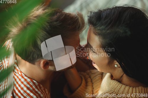 Image of Couple of lovers at home relaxing together, comfortable