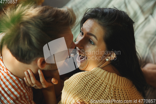 Image of Couple of lovers at home relaxing together, comfortable