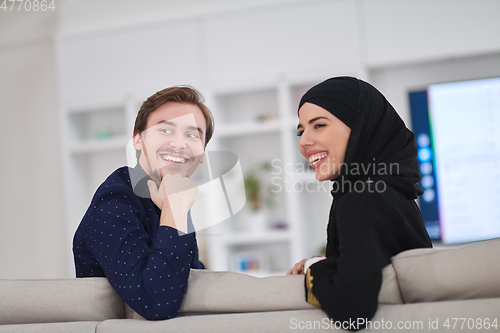 Image of Young muslim couple enjoing time together at home during Ramadan