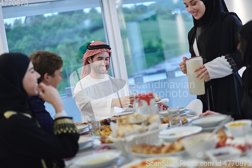 Image of Muslim family having iftar together during Ramadan