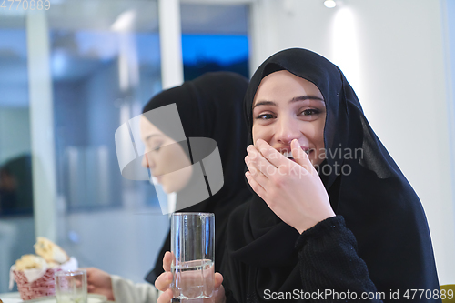 Image of Muslim family having iftar together during Ramadan