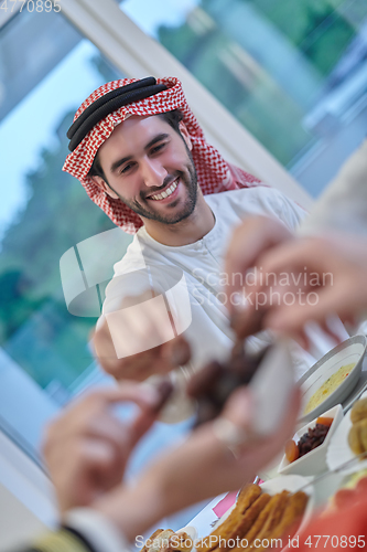 Image of Muslim family having iftar together during Ramadan.