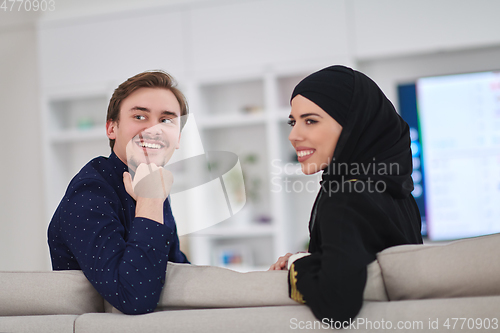 Image of Young muslim couple enjoing time together at home during Ramadan