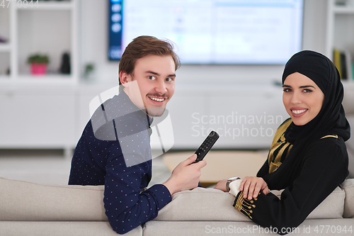 Image of Young muslim couple enjoing time together at home during Ramadan