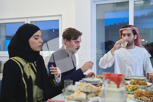 Image of Muslim family having iftar together during Ramadan