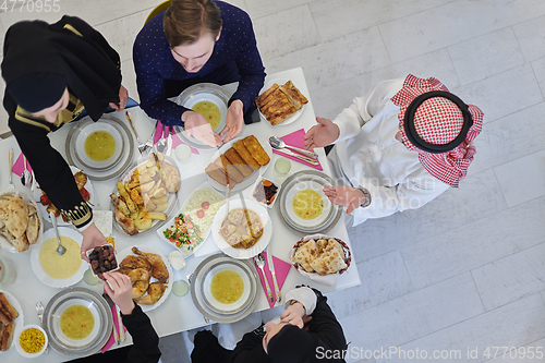 Image of Top view of muslim family having Iftar during Ramadan holy month