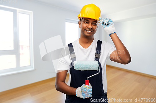 Image of happy indian painter or builder with paint roller
