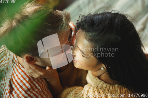 Image of Couple of lovers at home relaxing together, comfortable