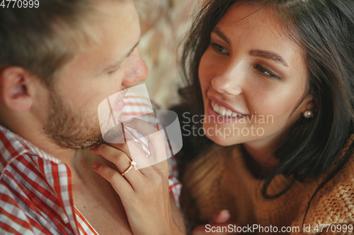 Image of Couple of lovers at home relaxing together, comfortable