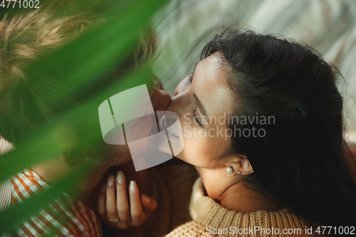 Image of Couple of lovers at home relaxing together, comfortable