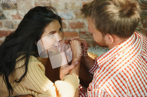 Image of Couple of lovers at home relaxing together, comfortable