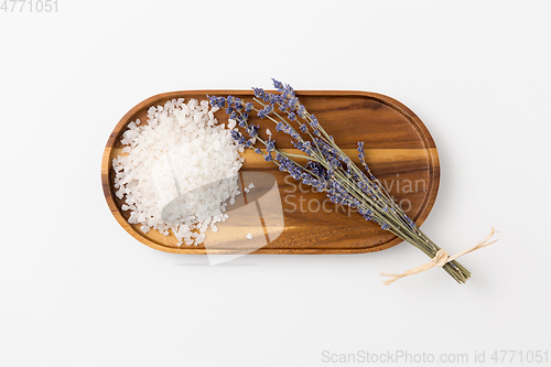 Image of sea salt heap and lavender on wooden tray