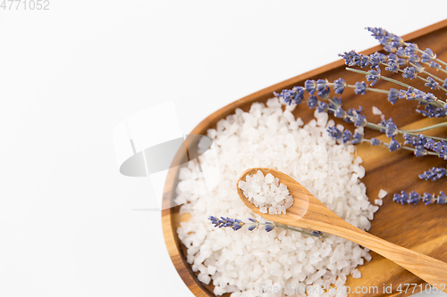 Image of sea salt heap, lavender and spoon on wooden tray