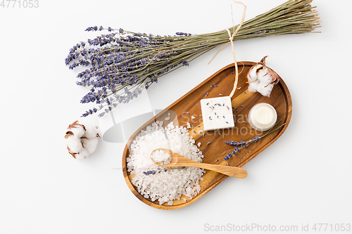 Image of sea salt, lavender soap and moisturizer on tray