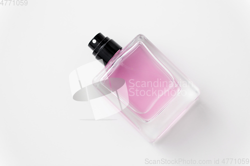 Image of bottle of perfume or pink toilette water