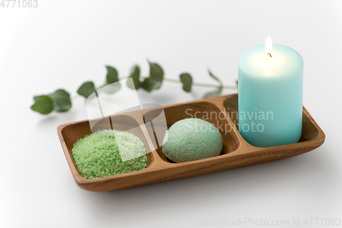 Image of bath salt, konjac sponge, candle and eucalyptus