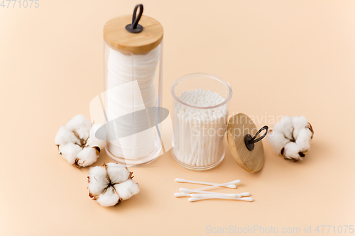 Image of white cotton pads and swabs in holders