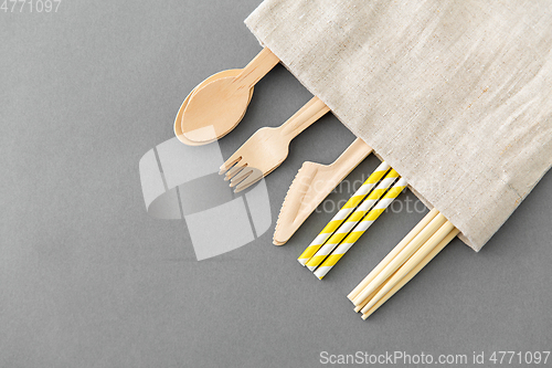 Image of wooden spoon, fork, knife, straws and chopsticks