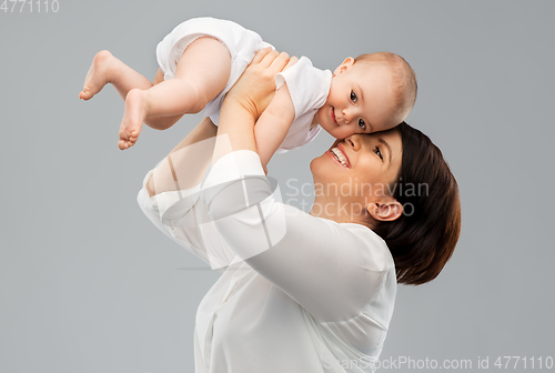 Image of happy middle-aged mother with little baby daughter