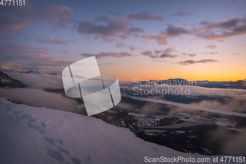 Image of Cloudy mountain sunset in winter