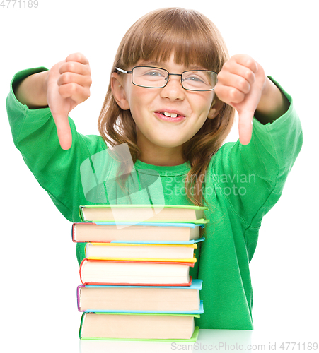 Image of Little girl is reading a book