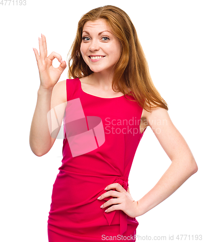 Image of Woman is showing OK sign