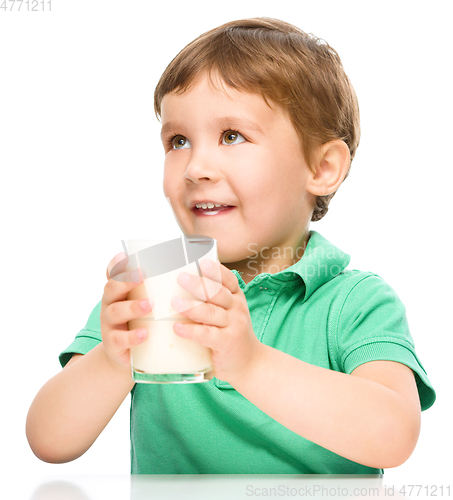 Image of Cute little boy with a glass of milk