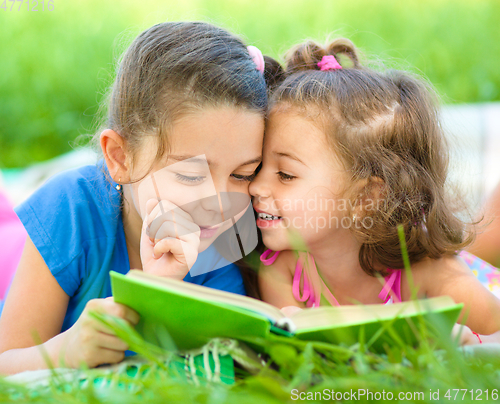 Image of Two little girls are reading book