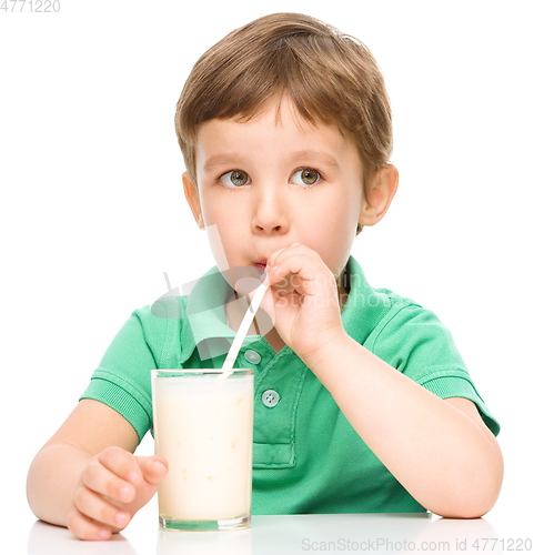 Image of Cute little boy with a glass of milk