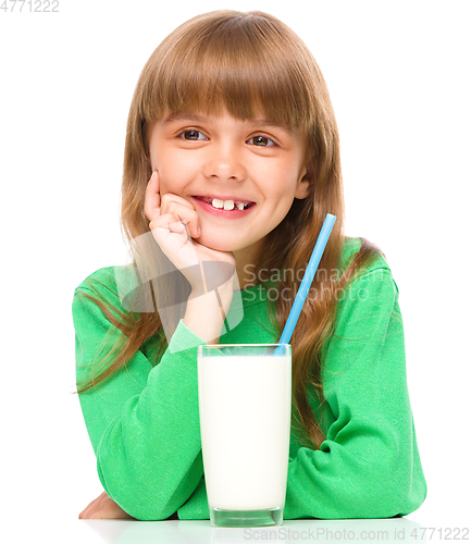 Image of Cute little girl with a glass of milk