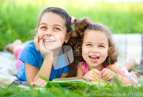 Image of Two little girls are reading book