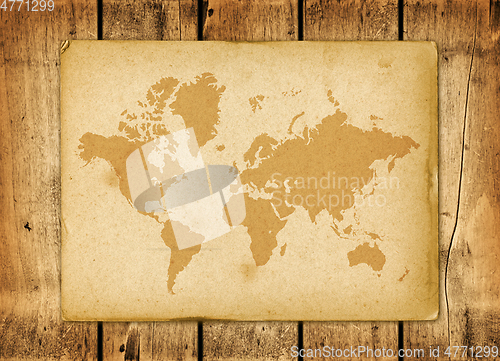 Image of Vintage world map parchment on a wooden wall