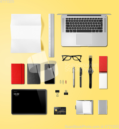 Image of Office desk branding mockup top view isolated on yellow