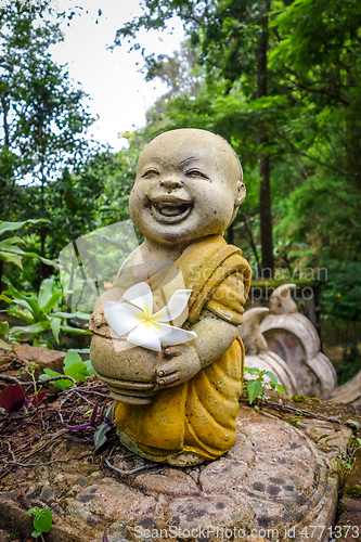 Image of Buddha statue in jungle, Wat Palad, Chiang Mai, Thailand