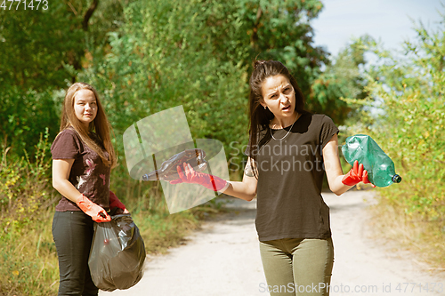 Image of Group of volunteers tidying up rubbish on beach