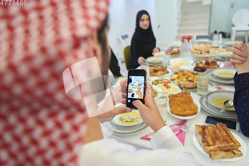 Image of Muslim family having iftar together during Ramadan