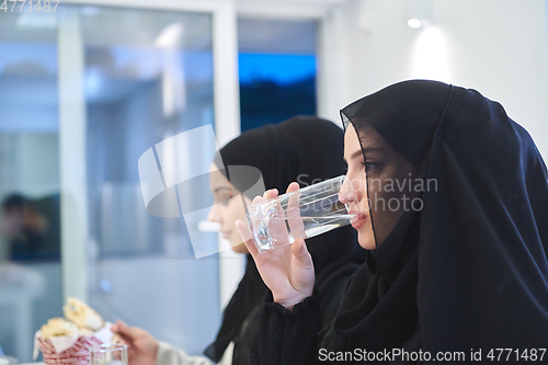 Image of Muslim family having iftar together during Ramadan