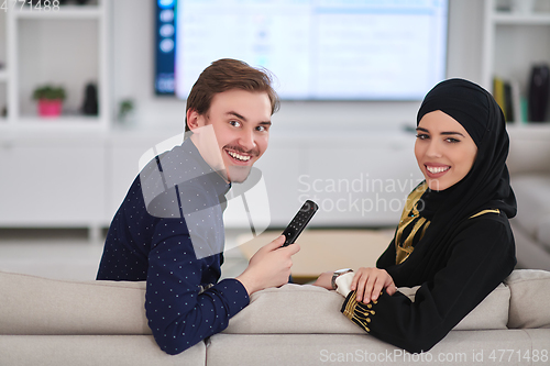 Image of Young muslim couple enjoing time together at home during Ramadan