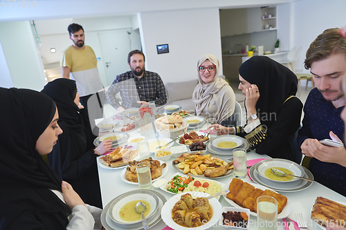 Image of Muslim family having iftar together during Ramadan.