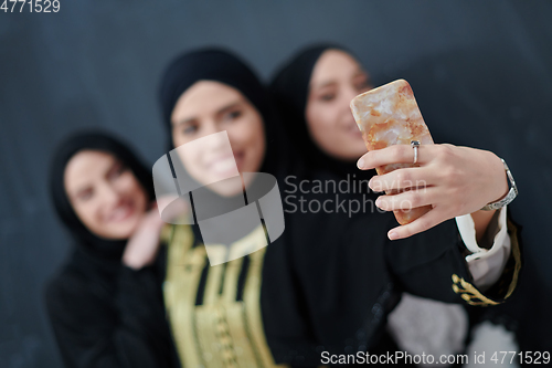 Image of Portrait of Arab women wearing traditional clothes or abaya