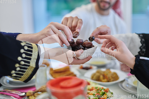 Image of Muslim family having iftar together during Ramadan.