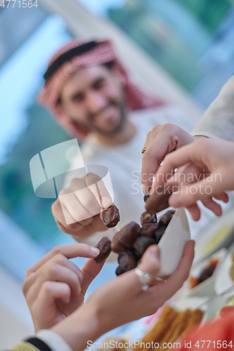 Image of Muslim family having iftar together during Ramadan.