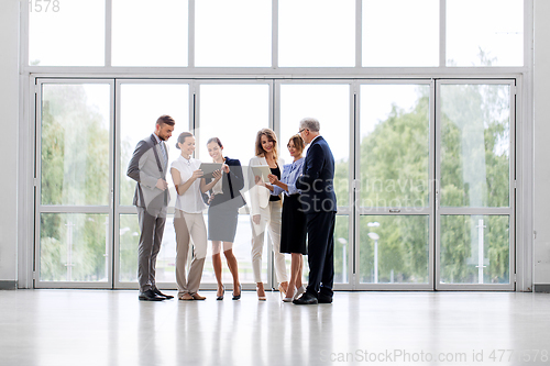 Image of business people with tablet pc computers at office