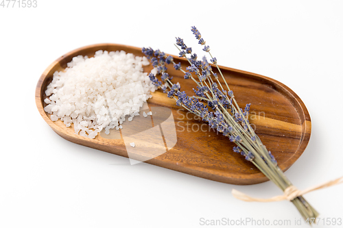 Image of sea salt heap and lavender on wooden tray