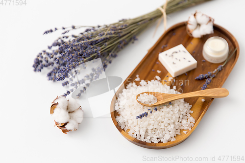 Image of sea salt, lavender soap and moisturizer on tray