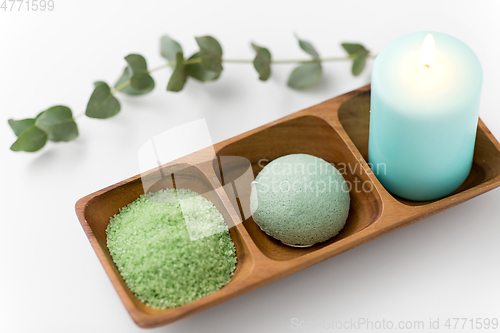 Image of bath salt, konjac sponge, candle and eucalyptus